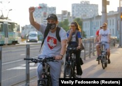 Minsk, Belarus - Participants ride bicycles during a protest flash mob.