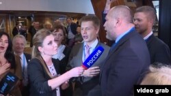 Ukrainian delegation at the Parliamentary Assembly of the Council of Europe sings their national anthem in response to a Russian state news reporter. 
