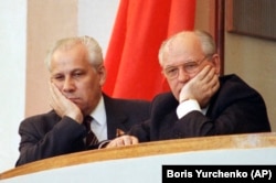 SOVIET UNION -- Soviet President Mikhail Gorbachev, right, and Vice President and politburo member Anatoly Lukyanov, at the podium during the opening session of Supreme Soviet of Russian at the Kremlin, Moscow, May 16, 1990