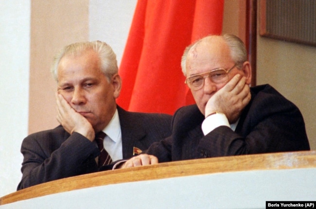 SOVIET UNION -- Soviet President Mikhail Gorbachev, right, and Vice President and politburo member Anatoly Lukyanov, at the podium during the opening session of Supreme Soviet of Russian at the Kremlin, Moscow, May 16, 1990