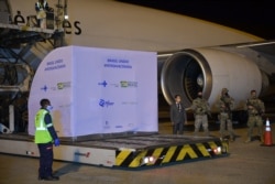 A container with 1,000,000 doses of the Pfizer-BioNTech vaccine arrives at the Viracopos International Airport in Campinas, on April 29, 2021.