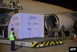A container with 1,000,000 doses of the Pfizer-BioNTech vaccine arrives at the Viracopos International Airport in Campinas, on April 29, 2021.