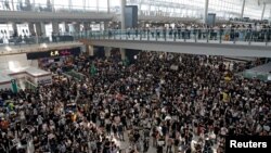 Anti-extradition bill protesters attend a mass demonstration at Hong Kong International Airport on August 12, 2019. (Tyrone Siu/Reuters)