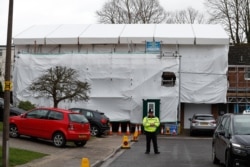 U.K. -- A pictures shows covered tarpaulin and scaffolding and secured by police the former home of Russian ex-spy Sergei Skripal in Salisbury, March 4, 2019.