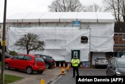U.K. -- A pictures shows covered tarpaulin and scaffolding and secured by police the former home of Russian ex-spy Sergei Skripal in Salisbury, March 4, 2019.