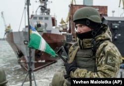 UKRAINE -- A Ukrainian serviceman stands on board a coast guard ship in the Sea of Azov port of Mariupol, eastern Ukraine, December 3, 2018.