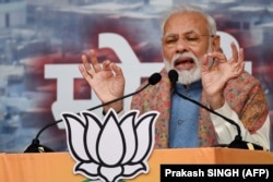 India's Prime Minister Narendra Modi speaks during a rally in New Delhi on December 22, 2019.