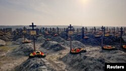 Graves of Russian Wagner mercenary group fighters are seen in a cemetery near the village of Bakinskaya in Krasnodar region, Russia, January 22, 2023. (REUTERS/Stringer) 
