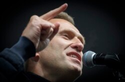 In this file photo taken on September 29, 2019 Russian opposition leader Alexei Navalny speaks during a demonstration in Moscow.