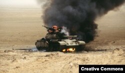 Burning Iraqi tank during Desert Storm operation, February 1991