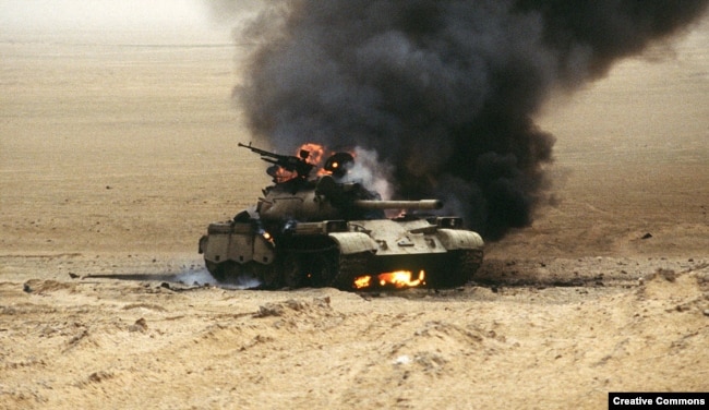 Burning Iraqi tank during Desert Storm operation, February 1991