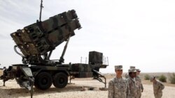 U.S. soldiers stand beside a U.S. Patriot missile system at a Turkish military base in Gaziantep, October 10, 2014.