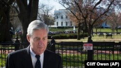 U.S. -- Special Counsel Robert Mueller walks past the White House after attending services at St. John's Episcopal Church, in Washington, March 24, 2019