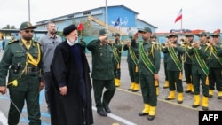 A handout picture made available by the Iranian presidential office on February 2, 2024 shows Iranian President Ebrahim Raisi (3rd L) visiting the Iranian revolutionary guards corps (IRGC) navy base in Bandar Abbas, southern Iran. (Photo by Iranian Presidency / AFP)