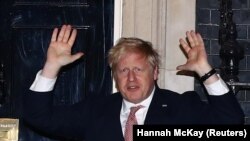 U.K. -- BritIsh Prime Minister Boris Johnson applauds outside 10 Downing Street during the Clap For Our Carers campaign in support of the NHS, as the spread of the coronavirus disease (COVID-19) continues, London, March 26, 2020