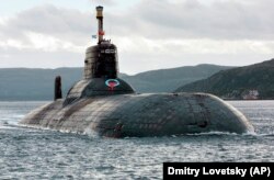 One of Russia's largest Soviet-built nuclear submarines, Typhoon (Akula) class, heaves ahead in the Barents Sea on Russia's Arctic Coast.