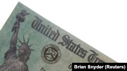 A family's stimulus check from the U.S. Treasury for the coronavirus disease (COVID-19) aid arrived in the mail in Milton, Massachusetts, U.S., March 25, 2021.
