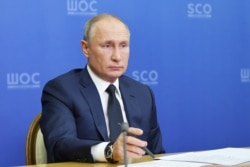Russian President Vladimir Putin attends the Shanghai Cooperation Organisation (SCO) Council meeting via video conference in the Bocharov Ruchei residence in the Black Sea resort of Sochi, November 10, 2020.