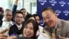 A Chinese tourist takes selfie with Thailand's Prime Minister Srettha Thavisin, during a welcome ceremony of the first batch of Chinese tourists under a five-month visa-free entry scheme at Bangkok’s International Airport, September 25, 2023.(REUTERS/Athit Perawongmetha)