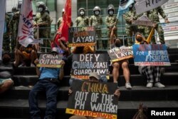 Activists stage a protest outside the Chinese Consulate in Makati City, the Philippines, on July 12, 2021. The protest marked the fifth anniversary of The Hague ruling invalidating Beijing's historical claims over the waters of the South China Sea.