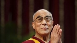 The Dalai Lama gestures before speaking to students during a talk at Mumbai University in this February 18, 2011. (Danish Siddiqui/Reuters)