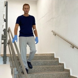 Russian opposition politician Alexei Navalny goes downstairs at Charite hospital in Berlin on September 19, 2020.