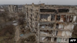 Residential buildings destroyed by shelling in Izyum, Kharkiv region, amid the Russian invasion of Ukraine. February 1, 2024 (Photo by Roman PILIPEY / AFP)
