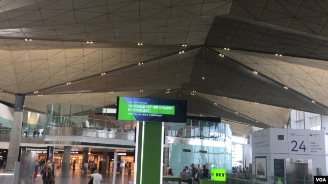 RT electronic advertising message board at the airport in St. Petersburg.