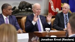 U.S. President Joe Biden, flanked by Environmental Protection Agency (EPA) Administrator Michael Regan and senior aide Steve Ricchetti, holds a meeting on infrastructure with labor and business leaders at the White House in Washington, U.S. July 22, 2021.