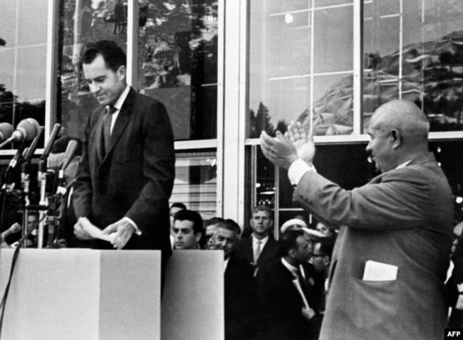 USSR -- US vice president Richard Nixon (L) being applauded by Soviet leader Nikita Khrushchev (R) after he delivered a speech during a visit at the American National Exhibition on July 27, 1959