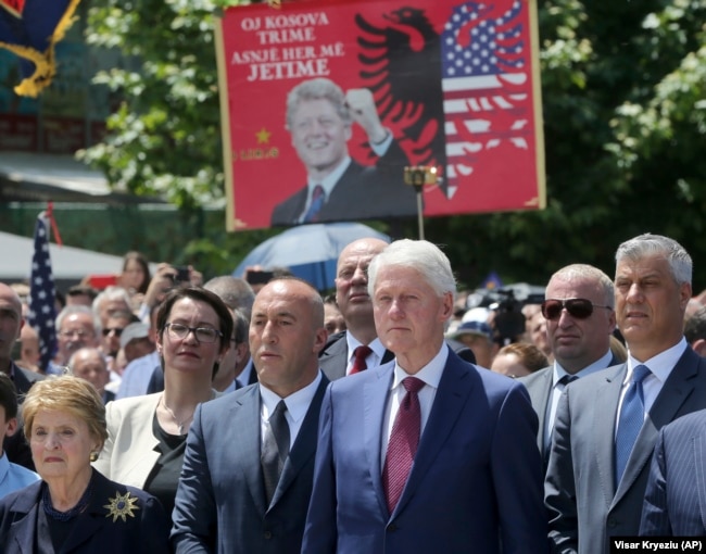 KOSOVO -- Former U.S. Secretary of State Madeleine Albright, left, Kosovar Prime Minister Ramush Haradinaj, second left, former U.S. President Bill Clinton, second right, and Kosovar President Hashim Thaci attend anniversary celebrations in Pristina, June 12, 2019.