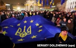 UKRAINE --A file picture made available 22 November 2014 shows Ukrainians waving an EU flag during a protest on Maidan Square, or Independence Square, in downtown Kyiv, Ukraine, 22 November 2013