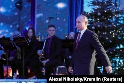 RUSSIA -- Russian President Vladimir Putin walks during a reception to mark the upcoming New Year holiday at the Kremlin in Moscow, Russia December 27, 2017