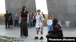 ARMENIA -- Reality TV personality Kim Kardashian and her sister Kourtney Kardashian with children visit Tsitsernakaberd Armenian Genocide Memorial in Yerevan, October 8, 2019