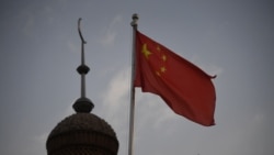 CHINA – Chinese flag flying over the Juma mosque in the restored old city area of Kashgar, in China's western Xinjiang region, on June 4, 2019.