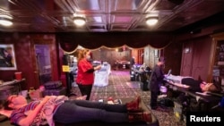 People donate blood at a Red Cross blood drive at The Magic Castle during the outbreak of the coronavirus disease (COVID-19), in Los Angeles, California, U.S., February 11, 2021. REUTERS/Mario Anzuoni
