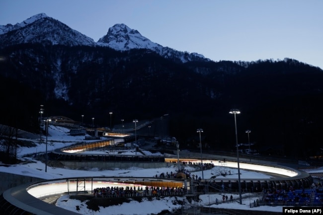 RUSSIA -- The Sanki Sliding Center is lit up for the start of the men's skeleton final competition at the 2014 Winter Olympics, Saturday, Feb. 15, 2014, in Krasnaya Polyana, Russia.