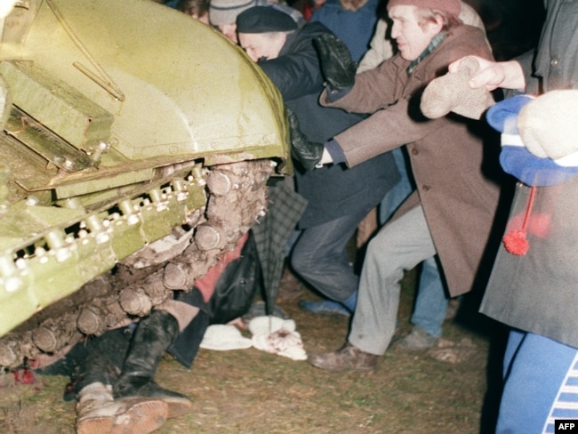 Lithuania -- A group of Lithuanians attempt to stop a Soviet Red Army tank from crushing a fellow protester during the assault on the Lithuanian Radio and Television station in Vilnius, 13Jan1991