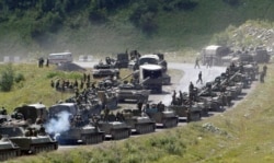 GEORGIA -- A column of Russian armored vehicles seen on their way to the South Ossetian capital Tskhinvali somewhere in the Georgian breakaway region, South Ossetia, August 9, 2008.