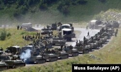 GEORGIA -- A column of Russian armored vehicles seen on their way to the South Ossetian capital Tskhinvali somewhere in the Georgian breakaway region, South Ossetia, August 9, 2008.