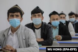 Ethnic minority students attend a class at the Urumqi Islamic Institution during a government-organized trip for foreign journalists in Urumqi on April 22.