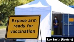 A sign is pictured at the drive-thru flu vaccination center, in Darlington, Britain September 29, 2020.