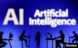 FILE PHOTO: Figurines with computers and smartphones are seen in front of the words "Artificial Intelligence AI" in this illustration taken, February 19, 2024. (REUTERS/Dado Ruvic)
