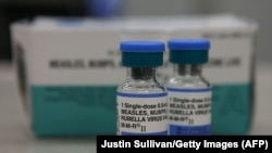 U.S. - vials of measles, mumps and rubella vaccine are displayed on a counter at a Walgreens Pharmacy, Mill Valley, California, January 2015.