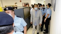 HONG KONG – Jimmy Lai is seen escorted by Hong Kong police at the Apple Daily office, on August 10, 2020.