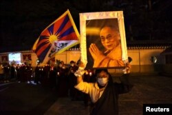 Tibetans in Taiwan attend a gathering to mark the 62nd anniversary of the failed 1959 Tibetan uprising against Chinese rule in Taipei on March 10, 2021. Ann Wang/Reuters