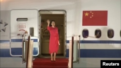 Huawei Technologies Chief Financial Officer Meng Wanzhou waves upon arriving from Canada at Shenzhen Baoan International Airport, in Shenzhen on September 25, 2021. (CCTV via Reuters)