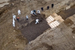 Drone pictures show bodies being buried on New York's Hart Island amid the coronavirus disease (COVID-19) outbreak in New York City, U.S., April 9, 2020.