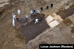 Drone pictures show bodies being buried on New York's Hart Island amid the coronavirus disease (COVID-19) outbreak in New York City, U.S., April 9, 2020.