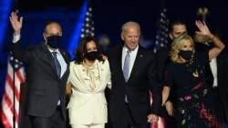 President-elect Joe Biden and Vice President-elect Kamala Harris stand with spouses after delivering election victory remarks in Wilmington, Delaware, on November 7, 2020.